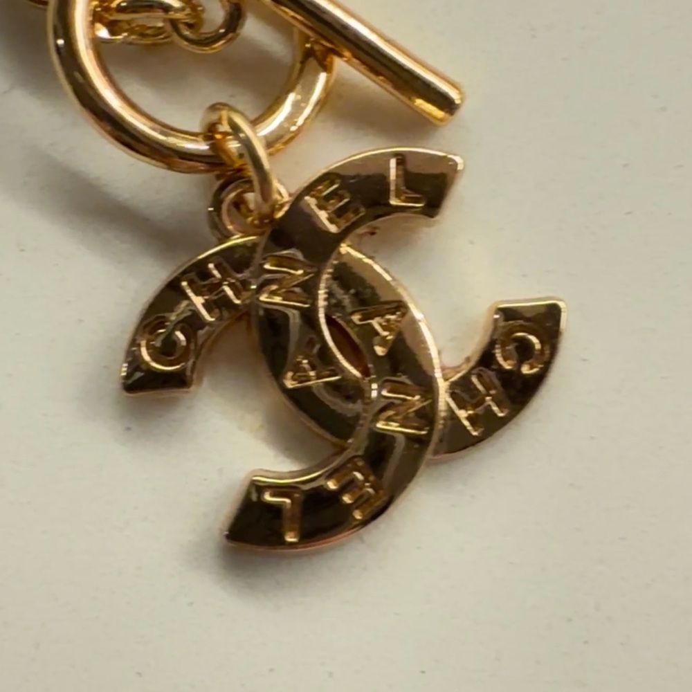 CHANEL Gold Interlocking Logo Charm on beautiful beaded necklace